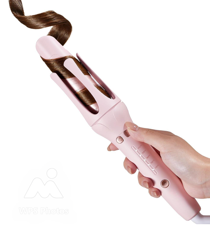 Pink hair curler being used on a white background