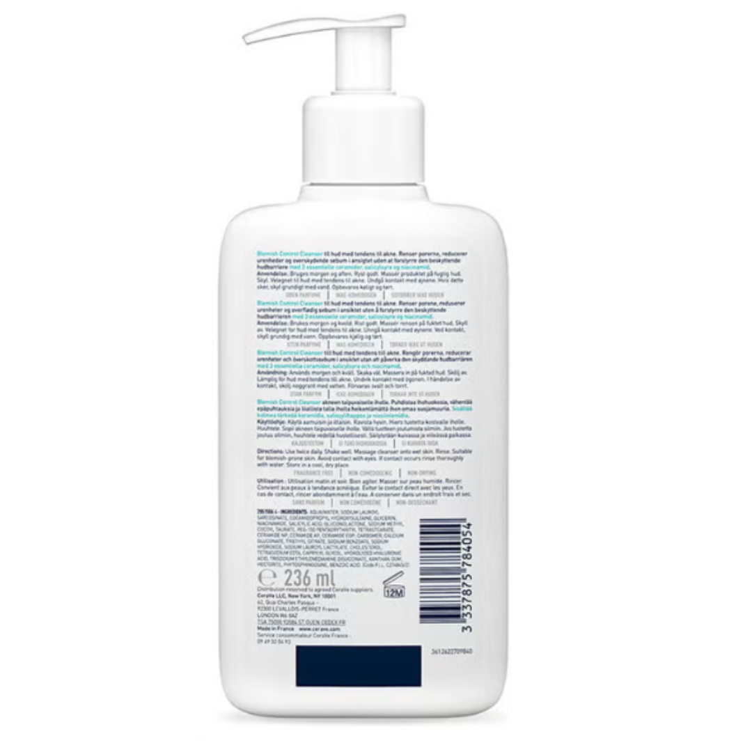 White bottle with pump and label on a white background