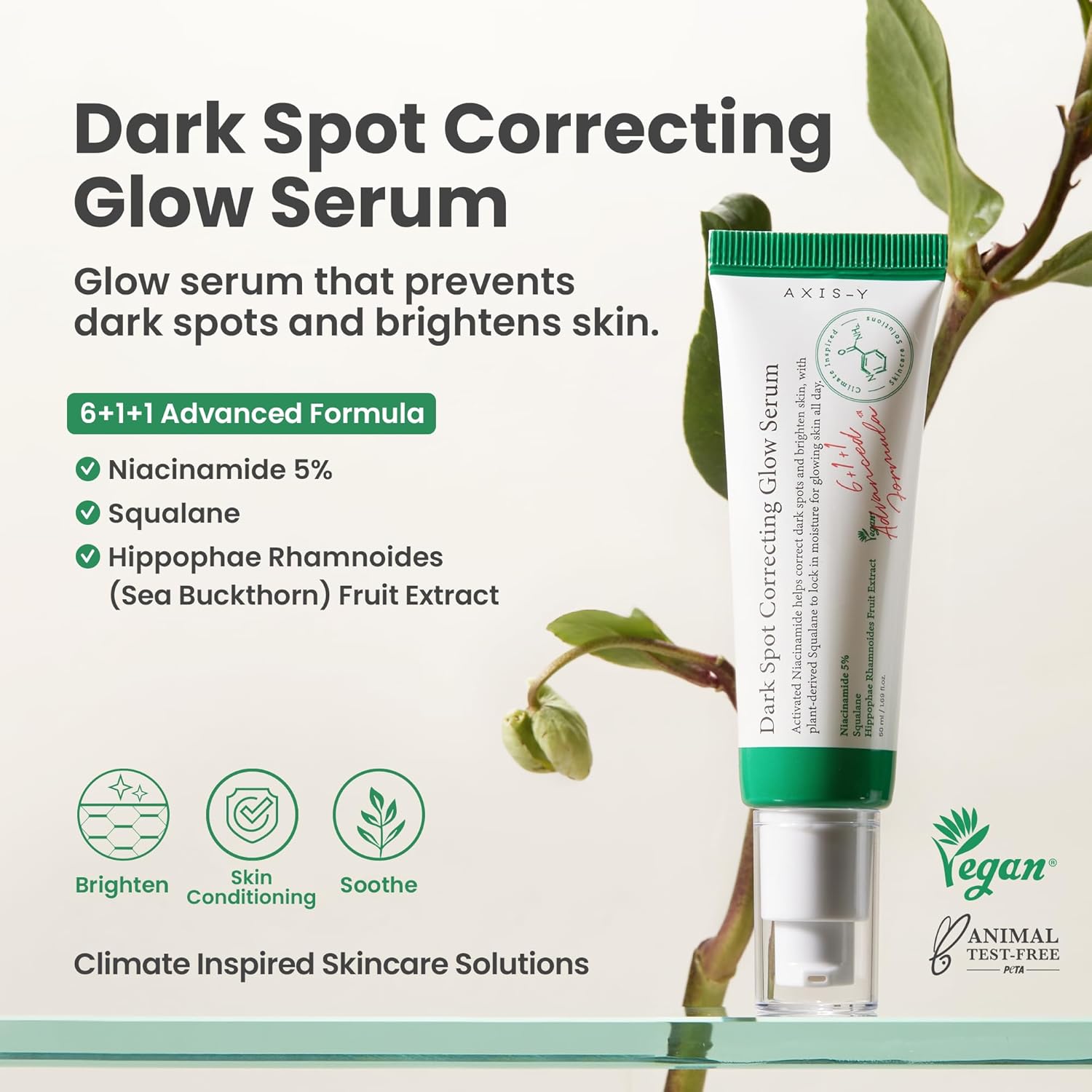 Dark spot correcting glow serum with green leafy background