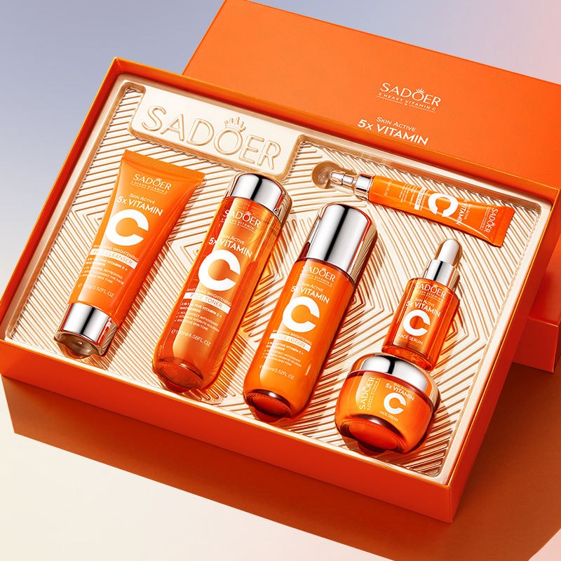 Sadoer skincare product set with orange and silver bottles in a box