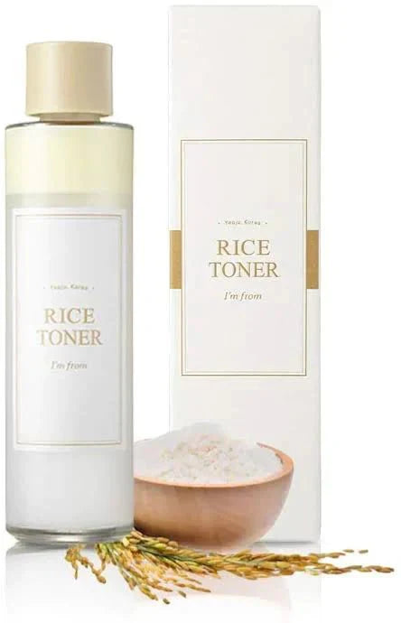 Rice toner bottle and packaging with a bowl of rice and grains on a white background